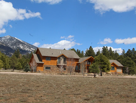 Wooden custom house with mountains