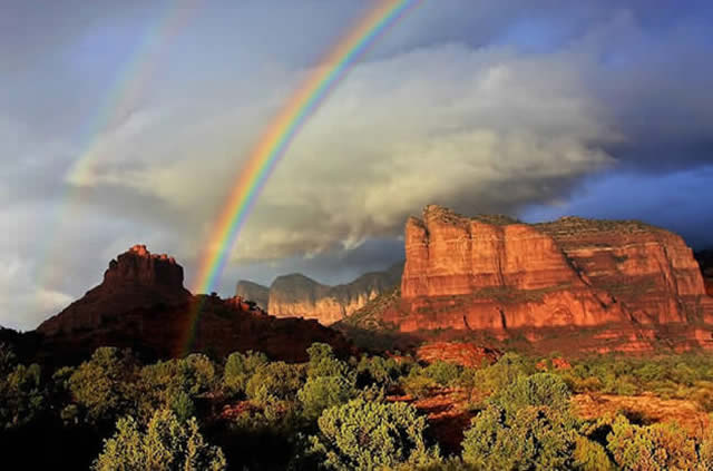 Red rock cliffs with rainbow